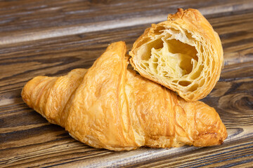 Croissants on a wooden background close-up.