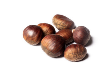 Obraz premium Ripe chestnuts close up. Raw Chestnuts for Christmas. Fresh sweet chestnut. Castanea sativa top wiew. Food background.