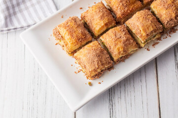 Traditional turkish new dessert cold milky baklava with pistachio (Turkish name; soguk baklava)