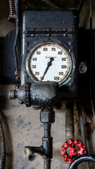 Fototapeta na wymiar Vintage steam-punk style locomotive engine control indicator dial
