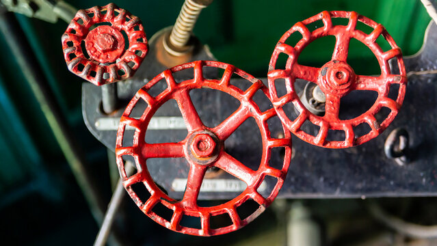 Grunge steam-punk mechanical background close-up of train locomotive parts, control valves, dials and knobs