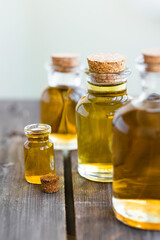 Assortment of organic essential oils. Natural moisturizing body and face treatment. Plant extract for healthy young skin. Relaxation, aromatherapy, salon spa. Close up, macro view