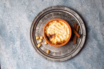 Baked rice pudding turkish milky dessert sutlac (Turkish name; firin sutlac)