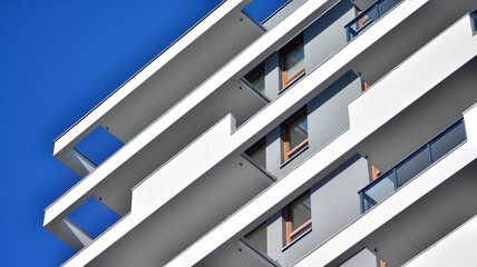 Fragment of modern residential apartment with flat buildings exterior. Detail of new luxury house and home complex.  