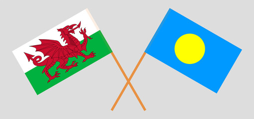 Crossed flags of Wales and Palau. Official colors. Correct proportion