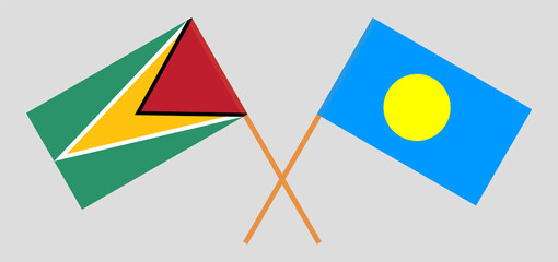 Crossed flags of Guyana and Palau. Official colors. Correct proportion