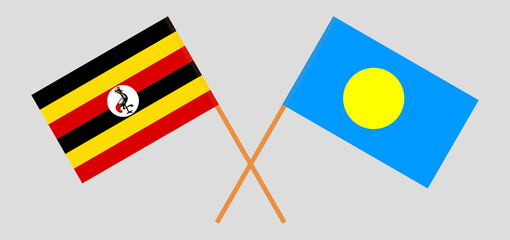 Crossed flags of Uganda and Palau. Official colors. Correct proportion