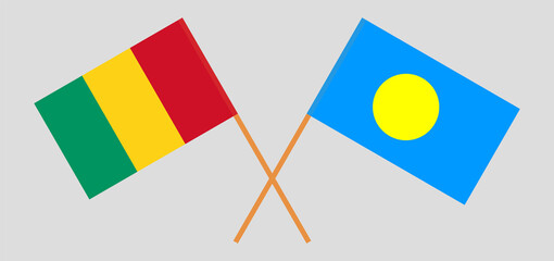 Crossed flags of Guinea and Palau. Official colors. Correct proportion