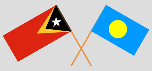 Crossed flags of East Timor and Palau. Official colors. Correct proportion