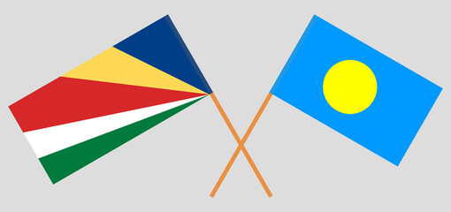 Crossed flags of Seychelles and Palau. Official colors. Correct proportion