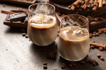 Cream and coffee cocktail in glasses with ice.