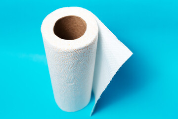 Top view of white paper towels on blue background.