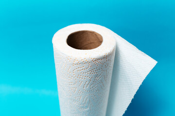 Close-up of white paper towels on blue background.