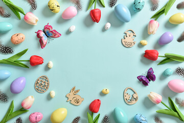 A frame with tulip flowers, Easter colored eggs and butterflies.