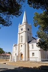 Fototapeta na wymiar White NG Church building with clock tower at Bethulie, Free State,South Africa