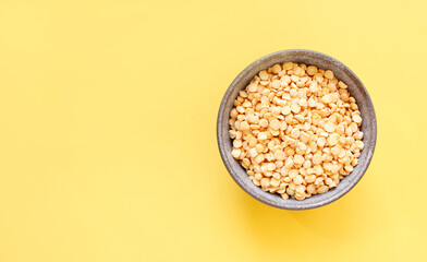 Pea groats on background. with copy space for your text, top view.