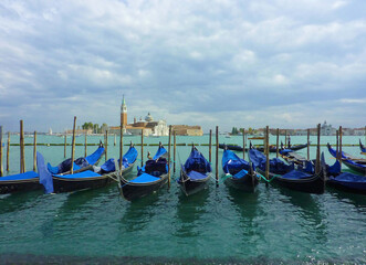 Venice (grand canal), row of Gondola boats, Italy