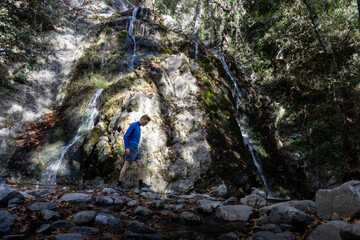 tourist at Chantara Waterfall in Troodos Mountains in Cyprus