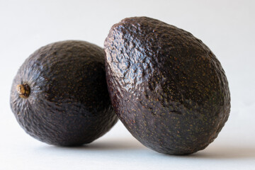 Two Hass Avocados in a Bowl