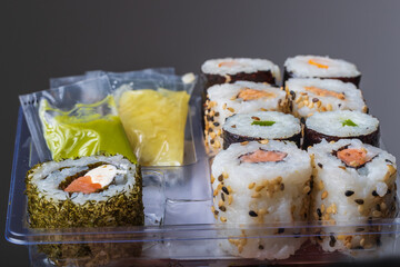 Prepared Japanese sushi, the background is dark.