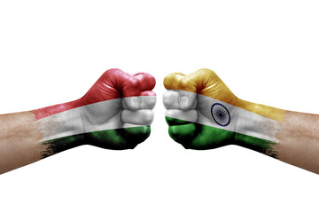 Two hands punch to each others on white background. Country flags painted fists, conflict crisis concept between hungary and india