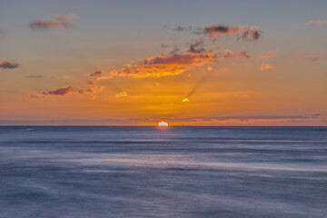 Sunset Behind Horizon from Ala Moana Beach in Hawaii
