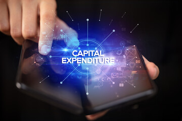 Businessman holding a foldable smartphone, new business concept