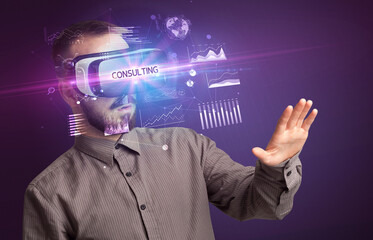 Businessman looking through Virtual Reality glasses