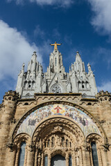 Christ statue on top of the Temple of the Sacred Heart of Jesus church on mount Tibidabo in Barcelona, Spain