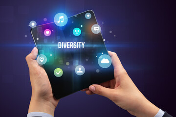 Businessman holding a foldable smartphone