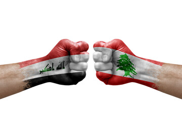 Two hands punch to each others on white background. Country flags painted fists, conflict crisis concept between iraq and lebanon