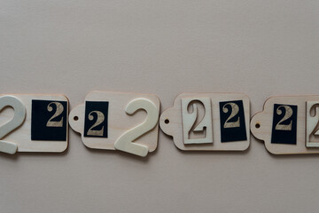 the number 2 on wooden tags on paper