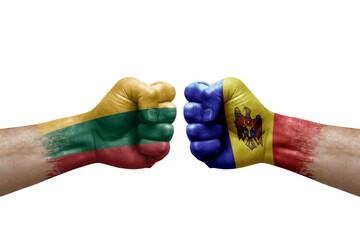 Two hands punch to each others on white background. Country flags painted fists, conflict crisis concept between lithuania and moldova