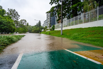 Roads flooded after the heavy rain in West End, Brisbane, Australia  - obrazy, fototapety, plakaty