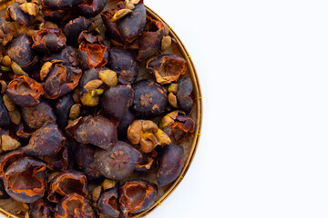 Dried mangosteen peel on white background.