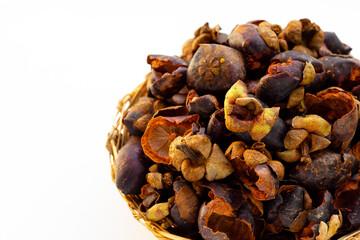 Dried mangosteen peel on white background.