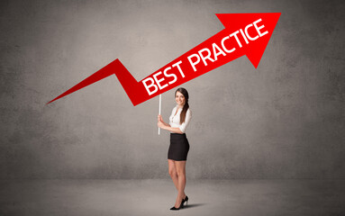 Fototapeta premium Young business person in casual holding road sign