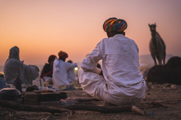 Pushkar, Rajasthan - India- January 20 2022 : A mid shot of an Indian man from rajasthan sitting...