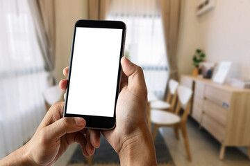 A man hand holding smart phone device in the bright office room