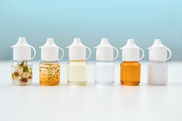 Alternative medicine can have surprising results. Studio shot of alternative forms of medication lined up on a table against a blue background.