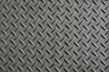 Silver painted metallic plate anti slip surface. Metal diamond plate texture.