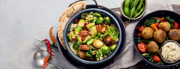 Vegan dishes assortment on light background.