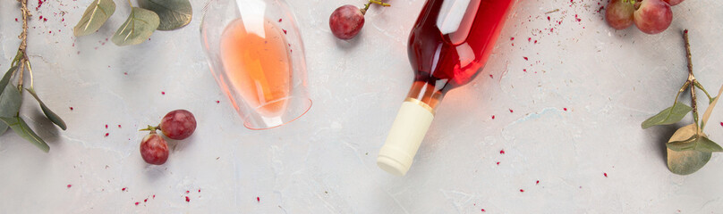 Fototapeta na wymiar Bottle of rose wine on gray background.