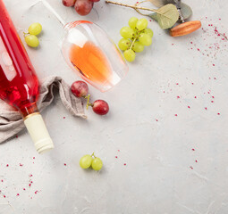 Bottle of rose wine on gray background.