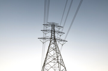 Abstract structure  high voltage transmission tower on sky background.
