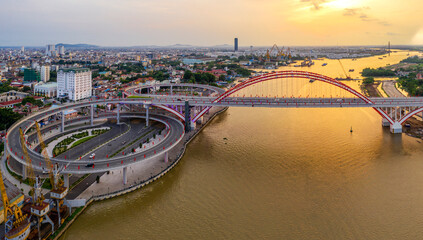 Hai Phong, Vietnam Aug 2020 Aerial view of a bridge from 300m above during sunset
