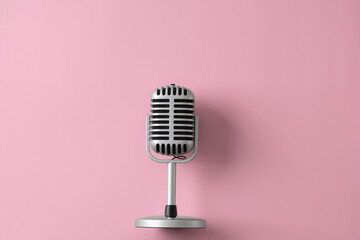 Retro microphone isolated on pink background