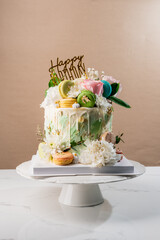 birthday cake with flower,macarons ans chocolate food anniversary concept cover banner background...
