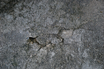 cracked cement covered with gray cement surface as background for design