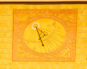  Sun clock located at building in Old town in Warsaw, Poland.